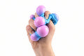 Colorful stress balls with child hands holding for calming sensory stimulation