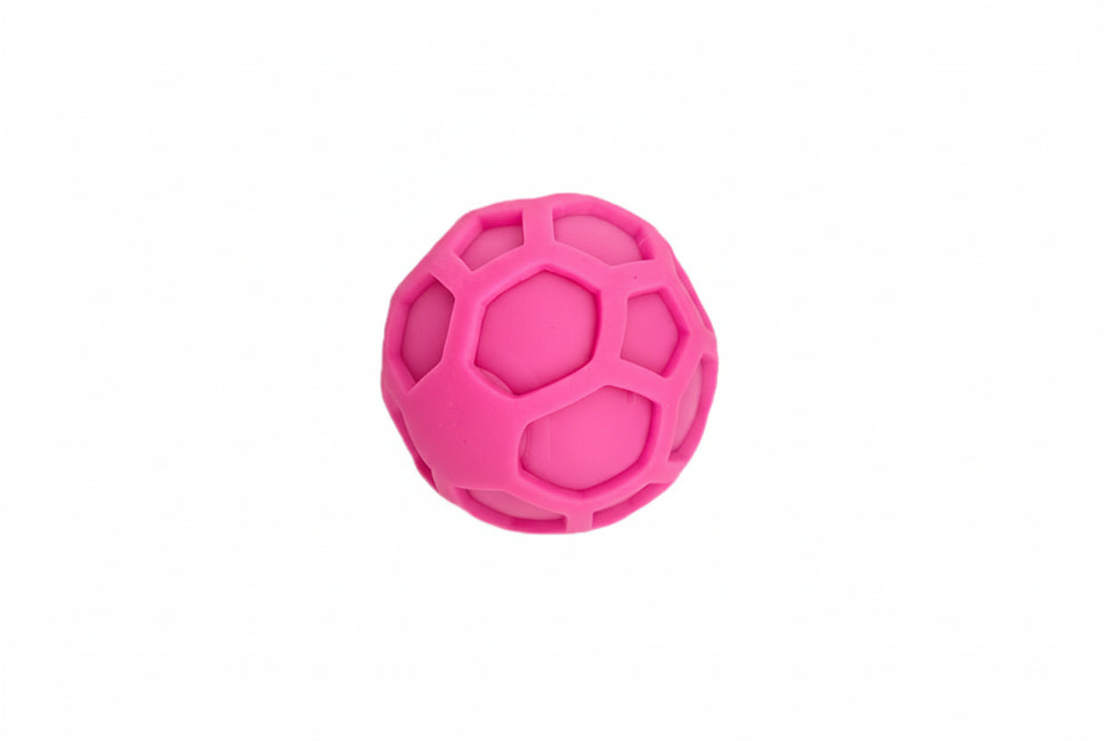 Quiet Pink textured squeeze ball for focus on a white background