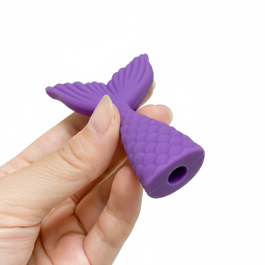 Child using decorative sensory pen topper in classroom