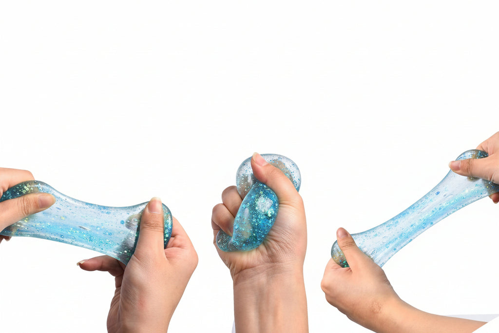 Shimmer glittery stress balls being held  squeezed and pulled by child hands for sensory regulation