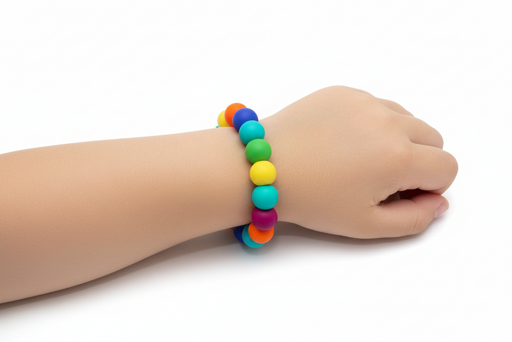 Child using chew bracelet during learning activities